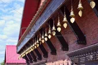Bronze bells under the roof of a Buddhist temple