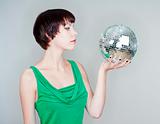 girl holding a disco ball