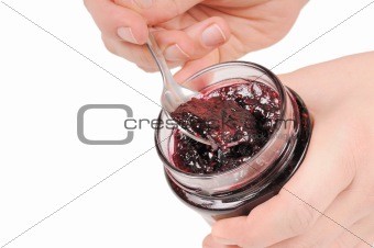 Canned jam and spoon