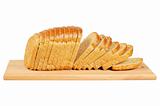 Sliced bread on wooden board.