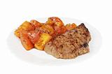 Plate with a beef steak and roasted tomatoes