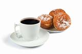 A cup of coffee and saucer with donuts