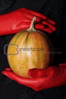 Woman holding halloween pumpkin