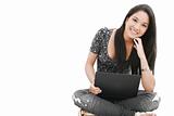 attractive young female sitting on the floor using laptop 