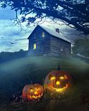 Halloween pumpkins in front of Spooky house