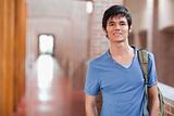 Smiling male student posing