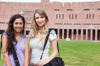 Smiling female students posing