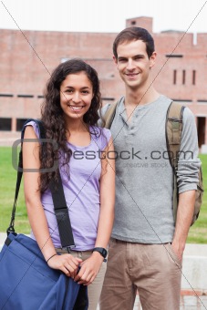 Portrait of a smiling student couple posing