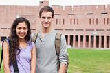 Smiling student couple posing