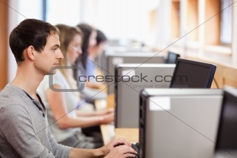 Male student using a computer
