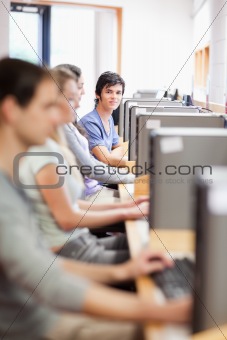 Portrait of young fellow students in an IT room