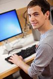 Portrait of a male student using a computer