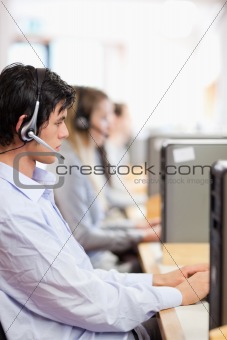 Portrait of young operators using a computer