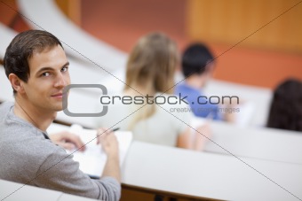Smiling student being distracted
