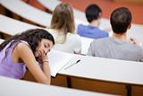 Young student sleeping during a lecture