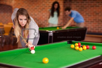 Student woman playing snooker
