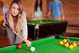 Woman playing snooker