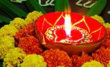 Vivid colours Diwali marigolds diva candle lamp