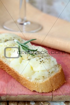 sandwich of white bread with mozzarella cheese and a glass of wine