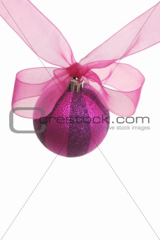 Red New Year's sphere and pink bow on a white background
