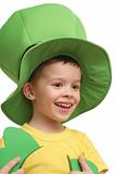 The beautiful happy boy in a green cap