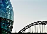 Rounded glass building and Tyne bridge