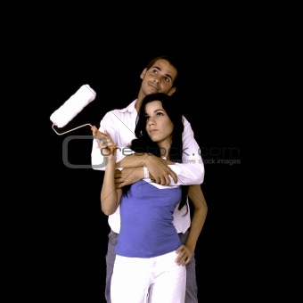 Couple holding a painter roller
