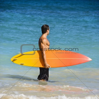 Man with surfboard.