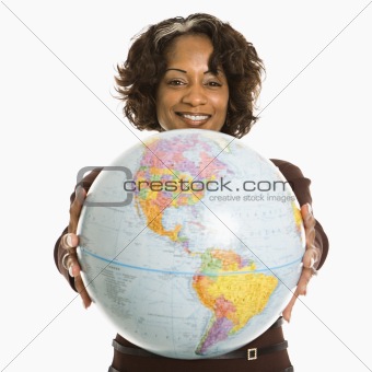 Woman holding globe.