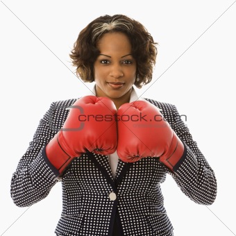 Businesswoman in boxing gloves.