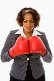 Businesswoman in boxing gloves.