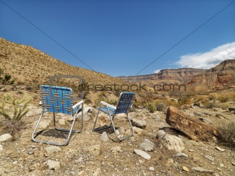 Chairs facing landscape.