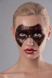 girl with a carnival mask make up