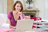 Woman sitting at her desk using laptop