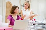 Women looking at paperwork together
