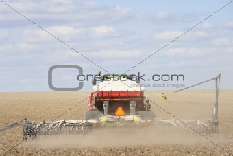 Tractor Planting Seed In Field