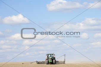 Tractor Planting Seed In Field