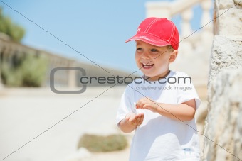 Portrait of cute boy in a red cap