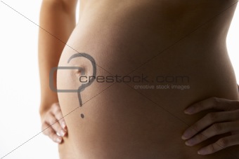 Detail Of Pregnant Woman With Question Mark On Stomach