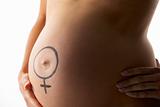Detail Of Pregnant Woman With Male Symbol On Stomach