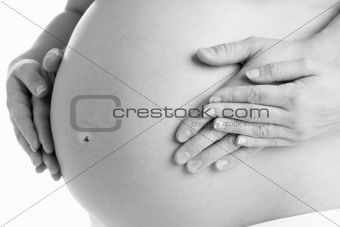 Couple Holding Pregnant Woman's Stomach