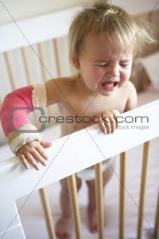 Crying Toddler With Arm In Cast