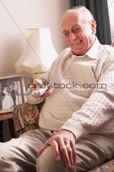 Senior Man Watching TV At Home