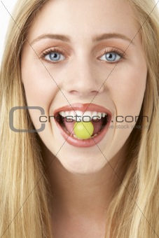 Portrait Of Young Woman Eating Grape