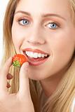 Portrait Of Young Woman Eating Strawberry