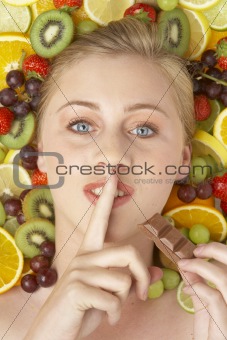 Portrait Of Young Woman Eating Chocolate