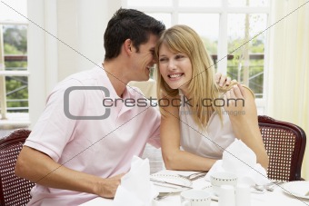 Young Couple Enjoying Hotel Meal