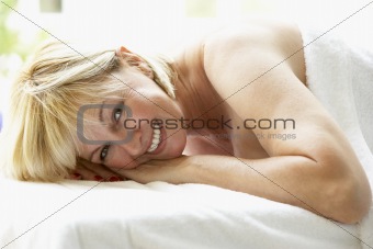 Middle Aged Woman Relaxing On Massage Table