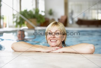 Middle Aged Couple In Swimming Pool