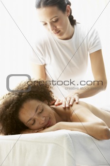Young Woman Enjoying Hot Stone Treatment